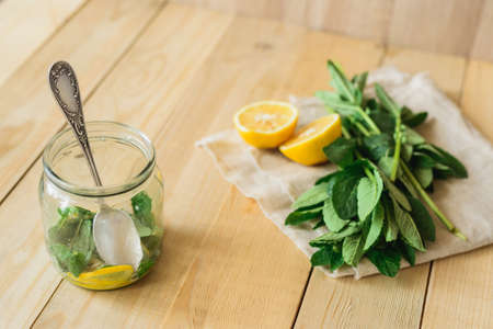 mint and lemon as ingredients for homemade lemonadeの写真素材