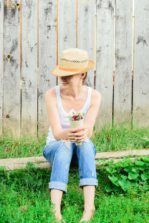 rustic harvester woman and fresh ripe cherriesの写真素材