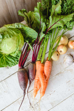 heap of different vegetables on white tableの写真素材