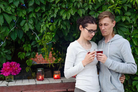 happy couple drinking wine outdoors with copy spaceの写真素材