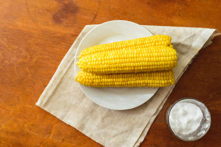 just cooked corn with salt on table, rustic conceptの写真素材
