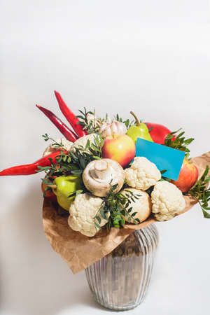 autumn bouquet of fresh fruits, vegetables and mushrooms as concept of accumulate vitamins for the winterの写真素材