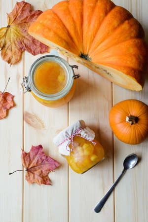 Autumn still life of homemade pumpkin jam on natural wood tableの写真素材