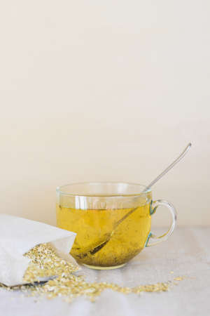 glass cup of herbal tea with dried chamomile flowersの写真素材