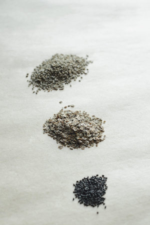 heaps of seeds on paper kraft background, top view of  still life, stock photo image