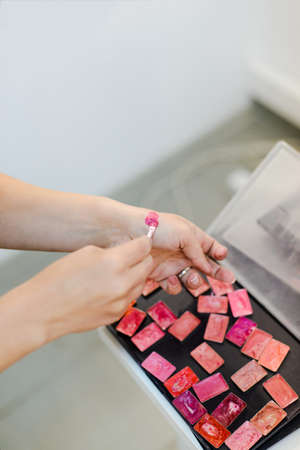 Stylist pick color of lipstick on his hand, stock photo imageの写真素材