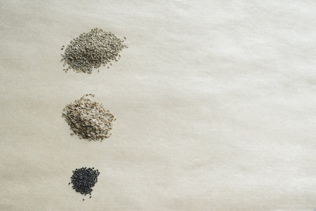 heaps of seeds on paper kraft background, top view of  flat lay still life with copy space, stock photo imageの写真素材