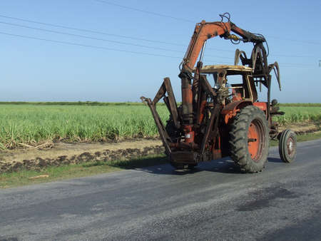 Sugar cane tractor, in a cuban country roadの写真素材