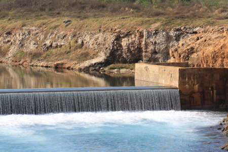Waterfall in a reservoir's dikeの写真素材