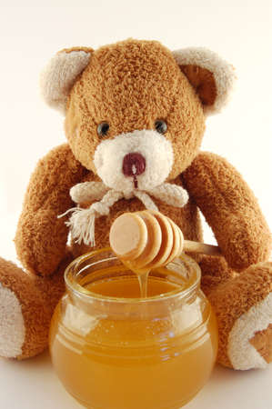 Teddy bear with honeyの写真素材
