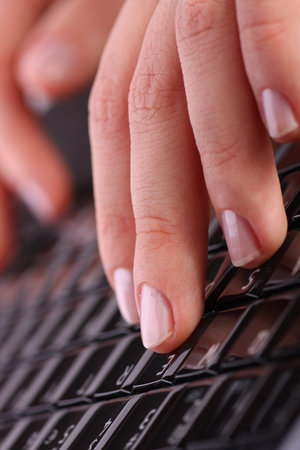 Female hands on laptop