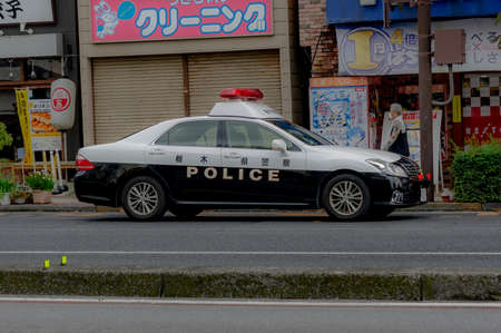 a black and white police car in japanの写真素材