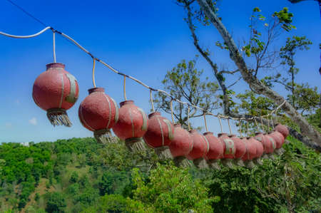 lanterns in a row under the blue sky.の写真素材