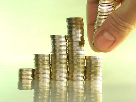 diagram consisting of piles of coins, denotes the artificial creation of the financial crisisの写真素材