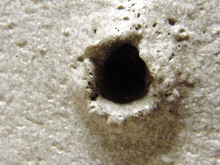hole in the concrete from the bubbleの写真素材