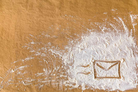 Envelope hand drawn on flour. Contact us concept.の写真素材