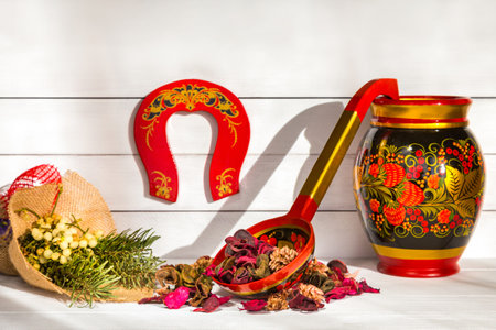 Russian traditional folk wooden tableware with floral pattern, Khokhloma ornament. Congratulation...