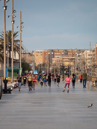 BADALONA, SPAIN - MAY 02 2020: People are allowed to do outdoor sport during the quarantine COVID-19 pandemicのeditorial素材