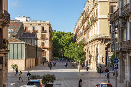 BARCELONA, SPAIN - June 16, 2020. View to the Ribera street with people walking on summer day during...