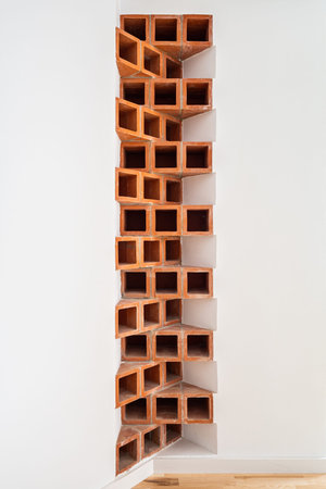 Brown brick masonry at white wall. Home design and decoration. Creative brick corner in the interior...