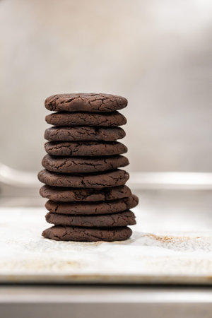 Stack of fresh chocolate cookies with copy space. Brownie homemade chips.