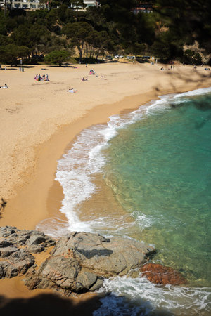 Costa Brava beach with turquoise water on sunny day