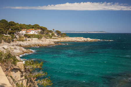 Beautiful turquoise water on the shore in Spain, Costa Brava in Catalonia on the sunny dayの写真素材