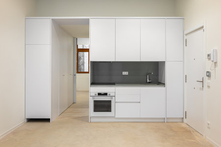 White empty classic kitchen in front view in new or refurbished apartmentの写真素材