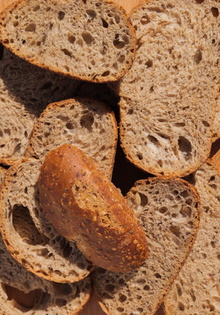 Sliced whole grain bread with visible seeds and airy texture