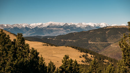 Snow-Capped Mountains Dominating the Horizon under a Clear Skyの写真素材