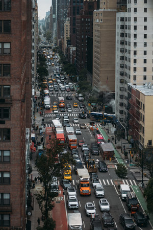 NEW YORK, USA - SEPTEMBER 26TH 2023: Busy street in New York City with heavy traffic and tall...