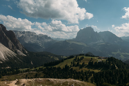 Experience the breathtaking and stunning beauty of the Dolomites, featuring majestic mountains and lush, green hillsの写真素材