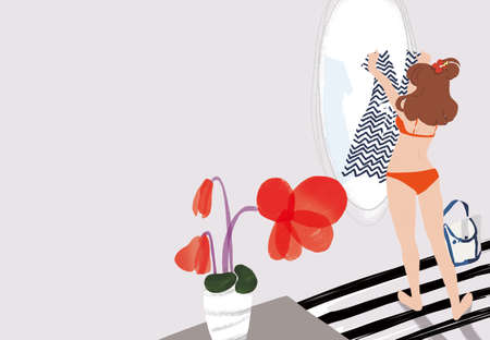 Girl getting ready in front of the mirrorの写真素材