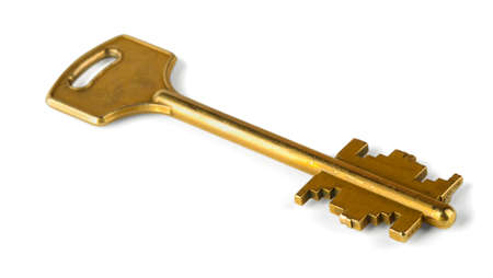Old gold key on a white backgroundの写真素材