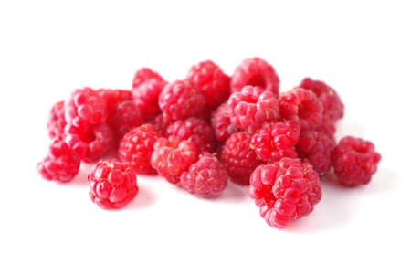 Group raspberries on a wite background