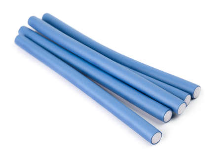 Blue hair curlers on a white backgroundの写真素材