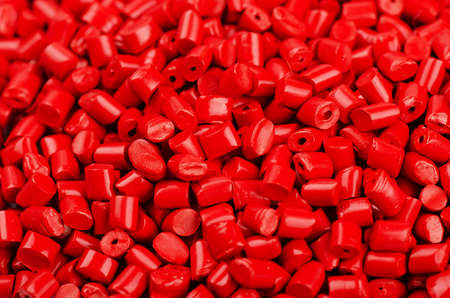 Little red plastic grains as backgroundの写真素材