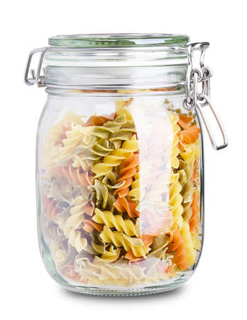Multicolor pasta in a jar isolated on white backgroundの写真素材