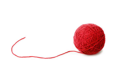 Clew of red wool thread isolated on white backgroundの写真素材