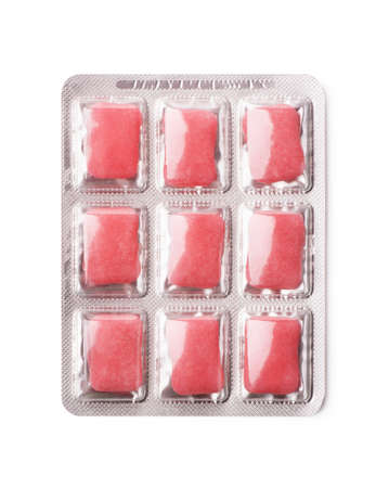 Pink chewing gum in blister isolated on a white background
