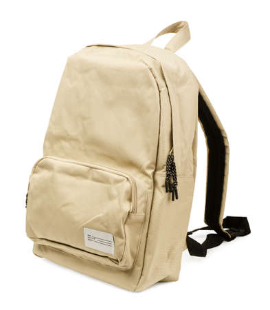 Cream backpack standing isolated on white background