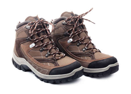 Pair of new hiking boots isolated on white backgroundの写真素材