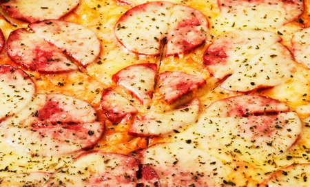 Pizza background close-up macro shot of pepperoni pizzaの写真素材
