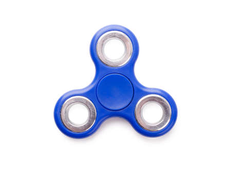 Popular blue fidget spinner stress relieving, anti-stress toy isolated on white backgroundの写真素材