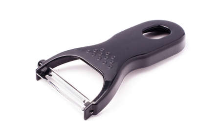 Black plastic vegetable peeler isolated on white background