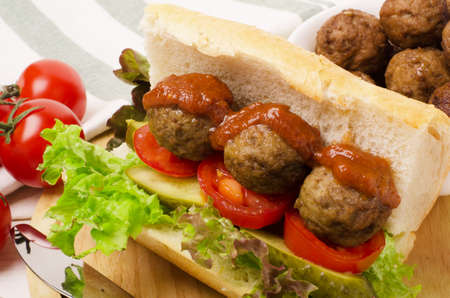 Tasty meatballs sandwich in a ciabatta with tomato sauceの写真素材
