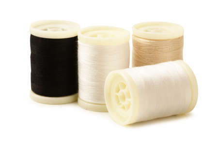 Four bobbin thread isolated on white background