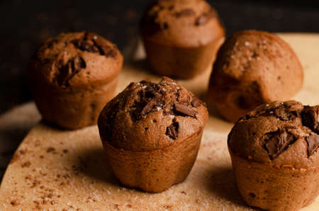 Chocolate cupcakes with chocolate chips on a dark background. Handmade.の写真素材