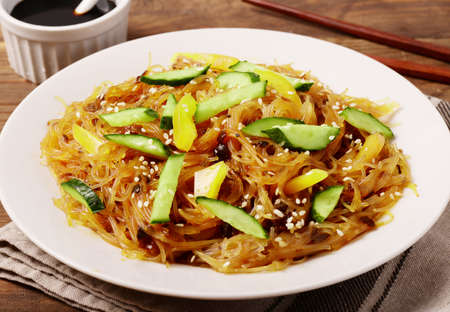 Ð¡ellophane noodles or thai vermicelli stir-fried with vegetables, pepper and cucumberの写真素材