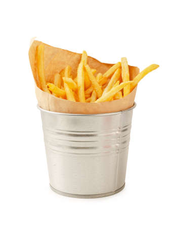 French fries in metal bucket isolated on a white backgroundの写真素材